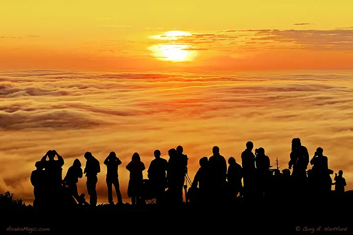 Large group of people watch the sunrise