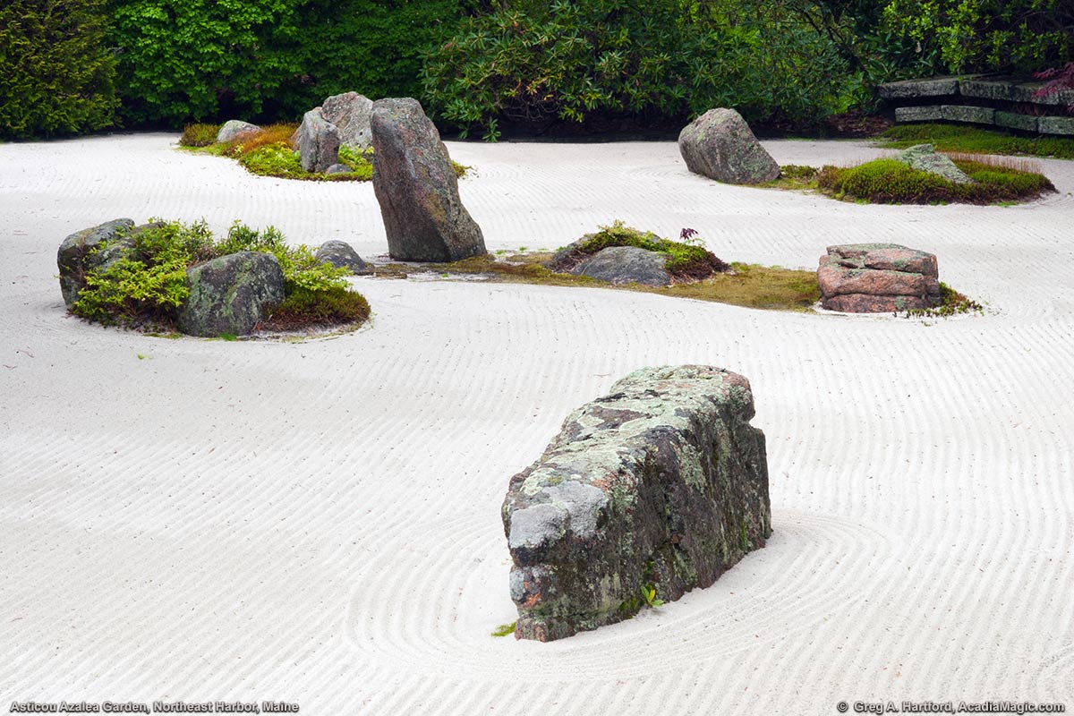 Japanese Styled Garden with rocks as islands in a white sea with waves