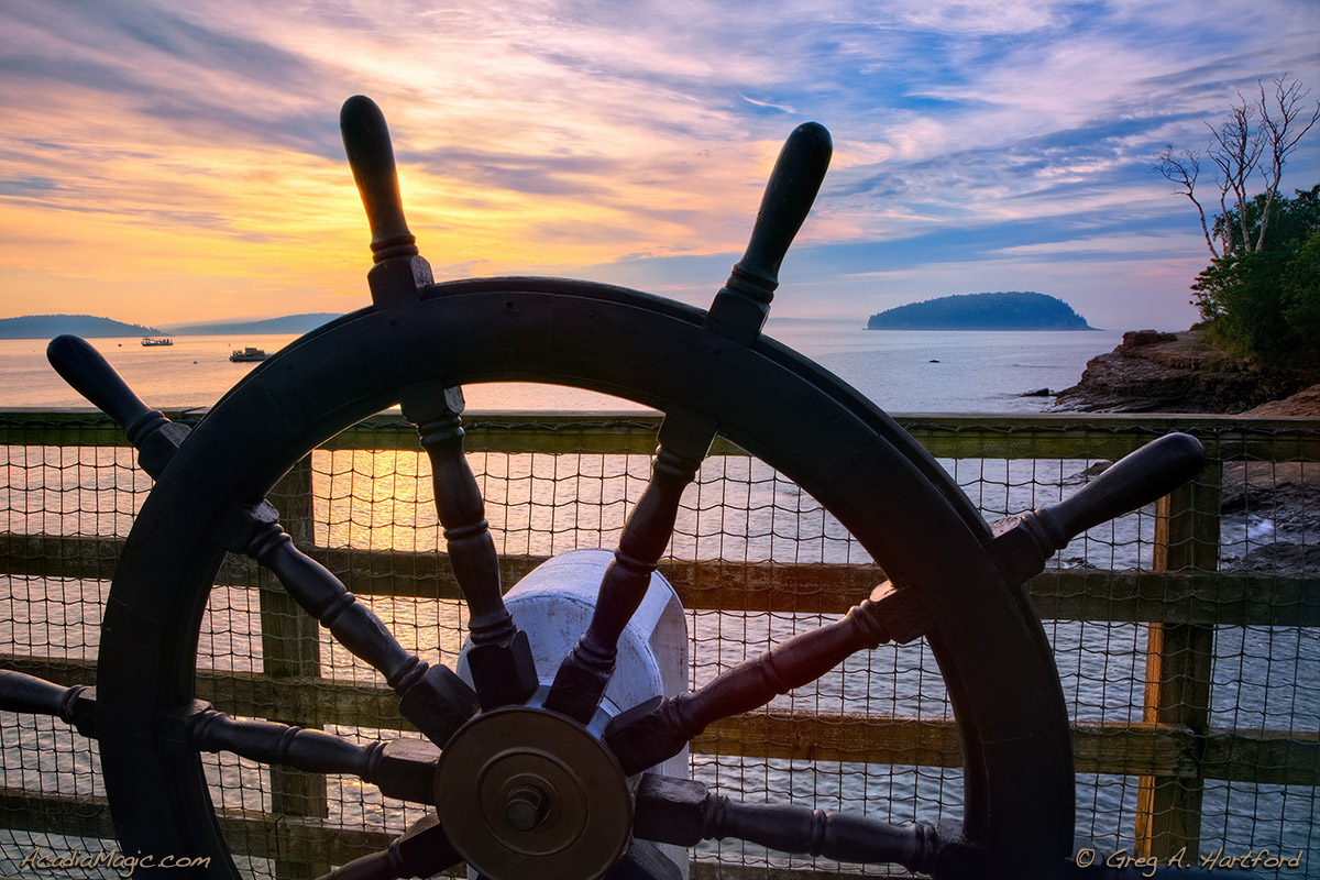 Ship navigation wheel at sunrise in Bar Harbor, Maine