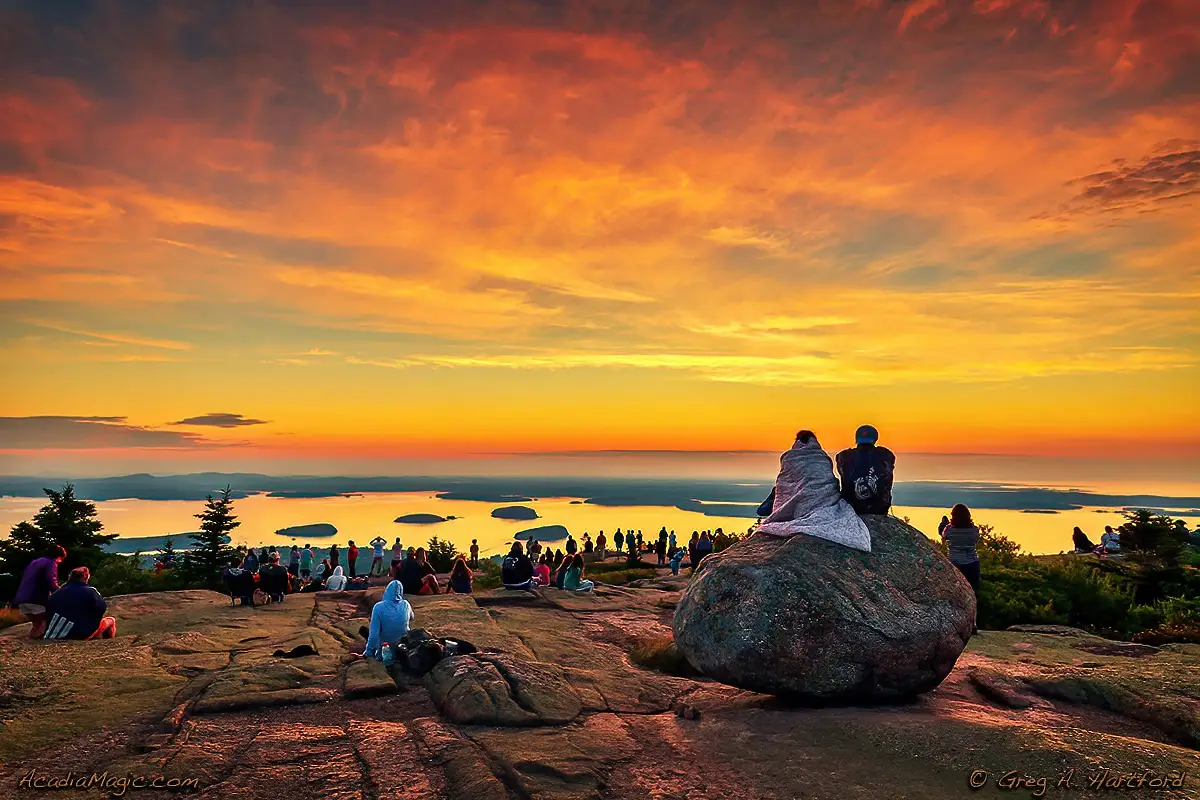 Vistors on Cadillac Mountain in Acadia National Park wait for the sun.