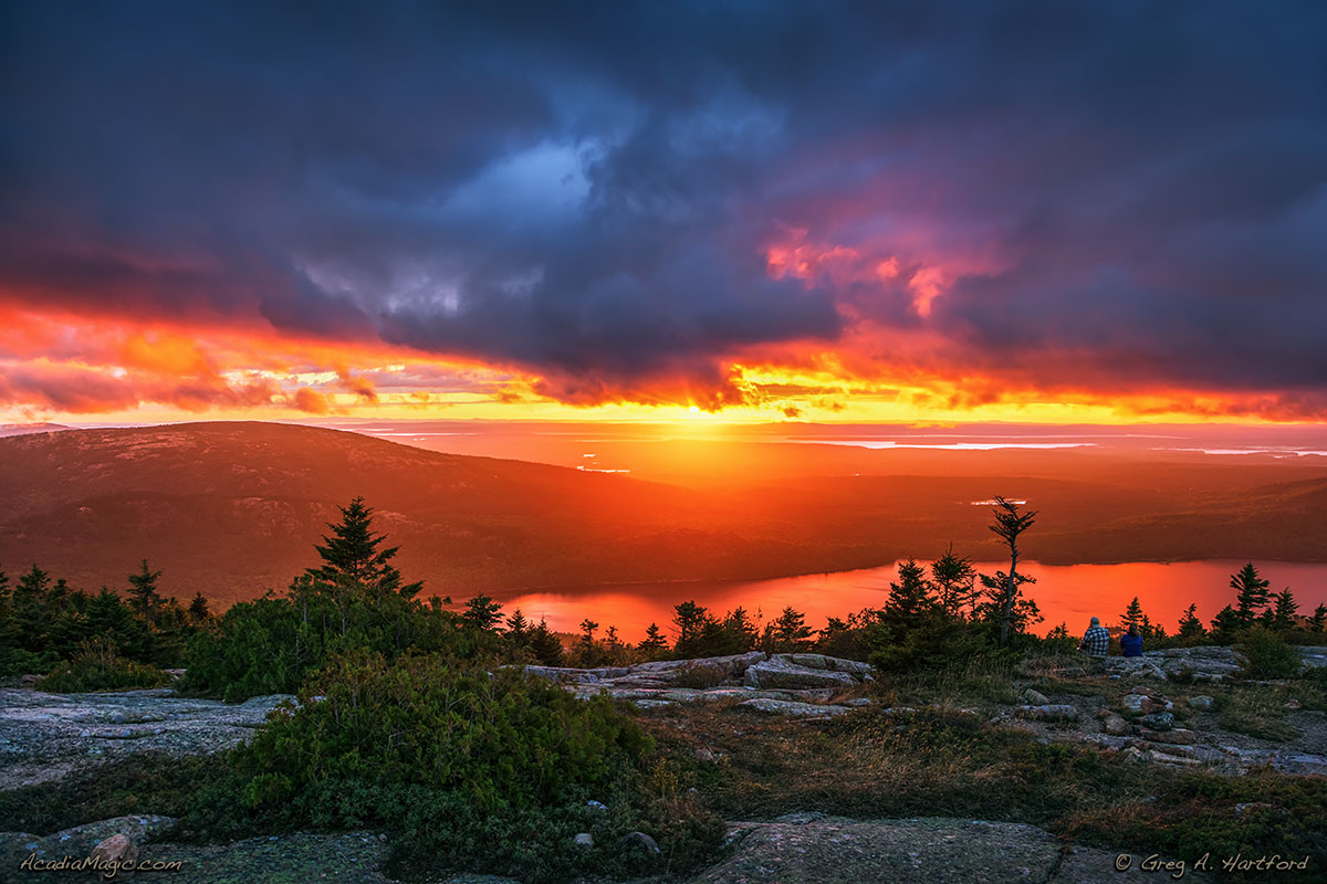 There was a long wait for the sun to shine below the clouds just before sunset on Cadillac Mountain in Acadia. Eagle Lake is far below.