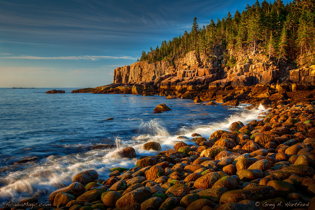A view of Otter Cliff on calm morning in Acadia National Park