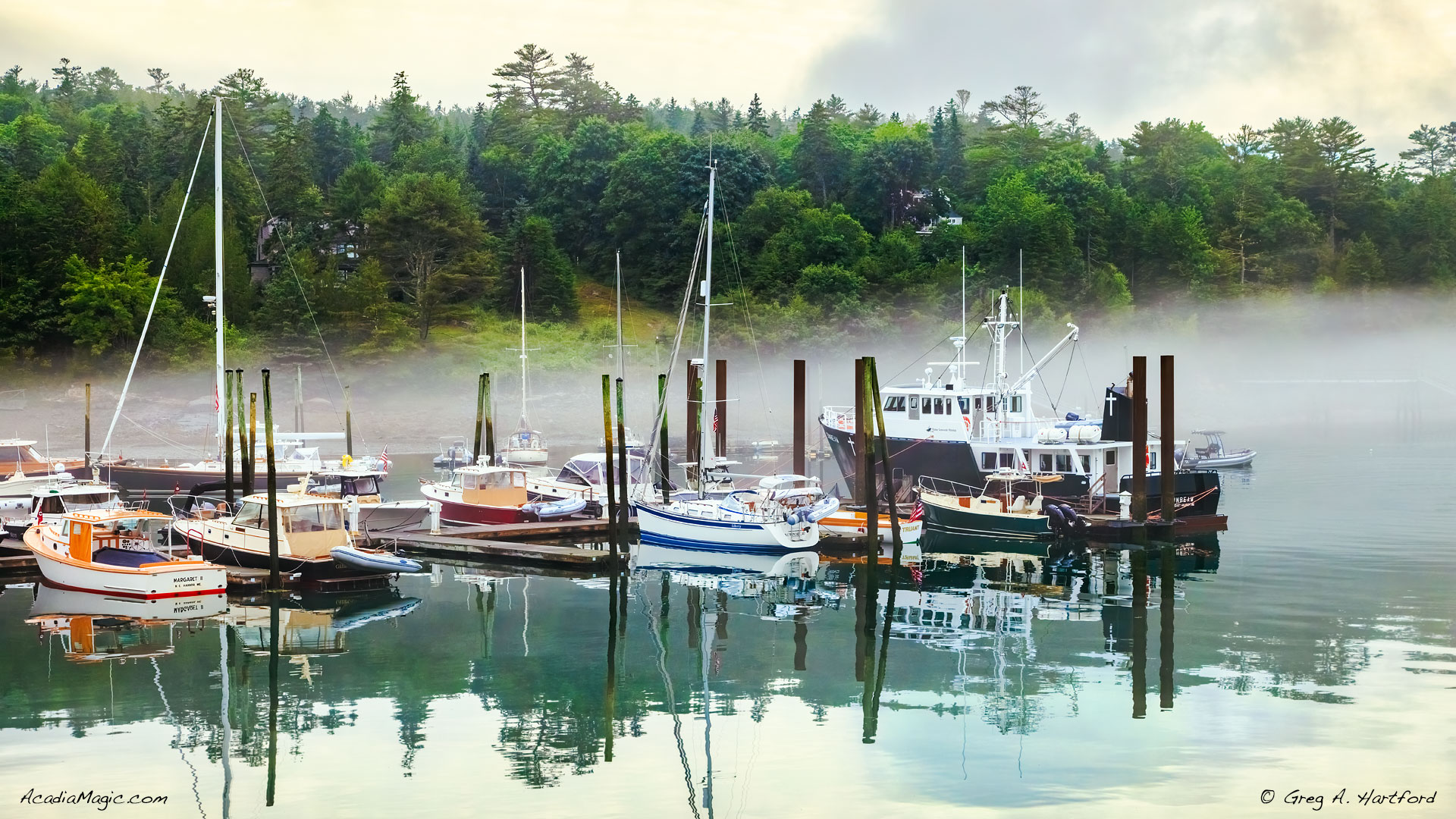 Foggy morning in Northeast Harbor, Maine showing yachts in harbor
