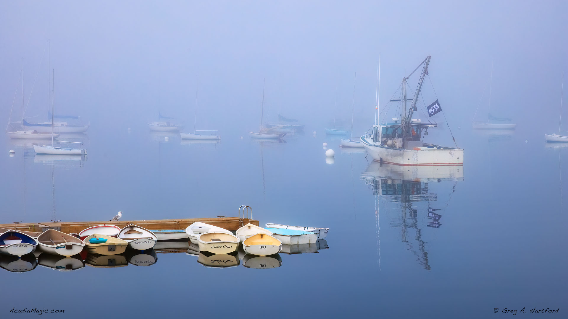 Foggy morning in Sorrento, Maine showing boats in harbor