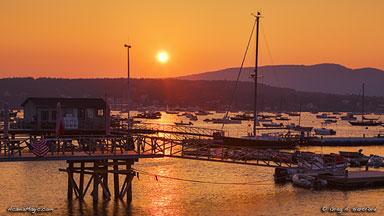 Sunset over Southwest Harbor, Maine with reflections across the surface of the ocean