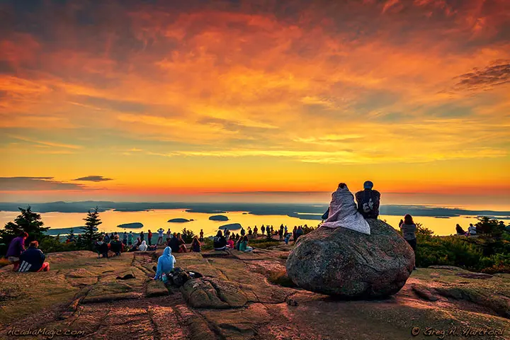 Visitors await the first light from the sun from atop Cadillac Mountain in Acadia.