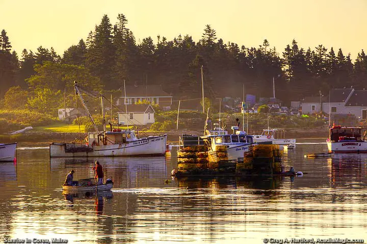 Fishermen row dinghy to lobster boat in harbor