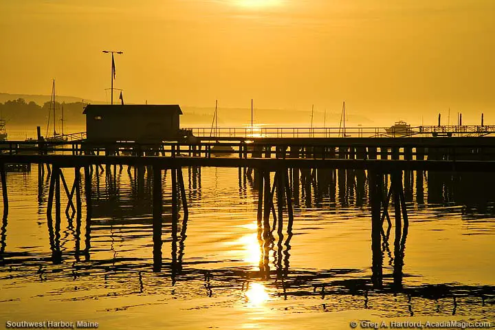 Reflections at pier with sunrise